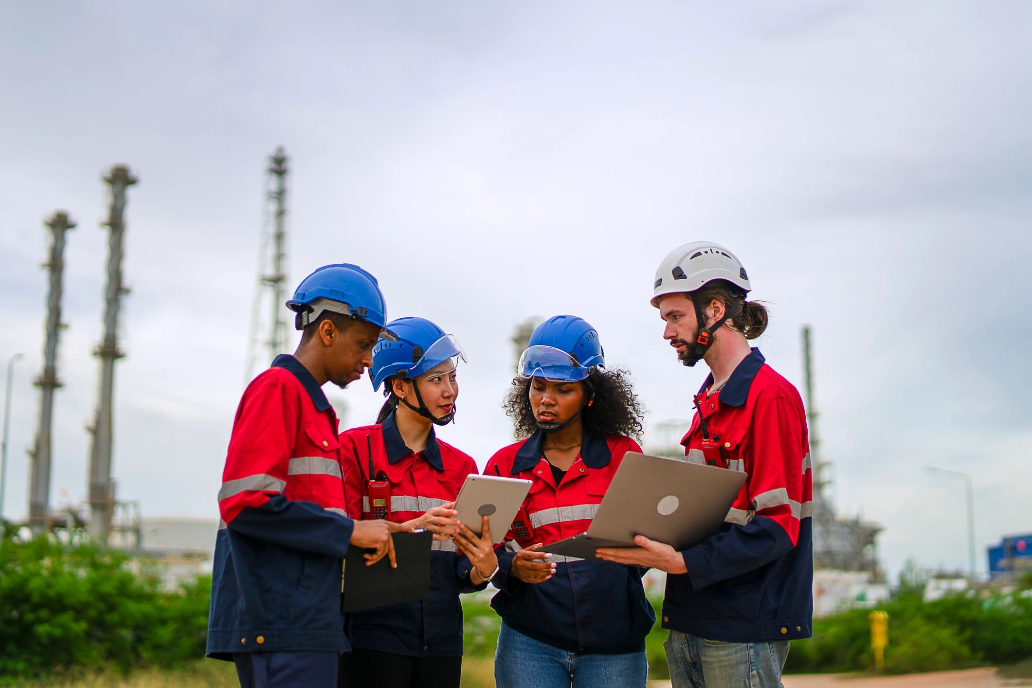 Industrial workers at an operational oil and gas site