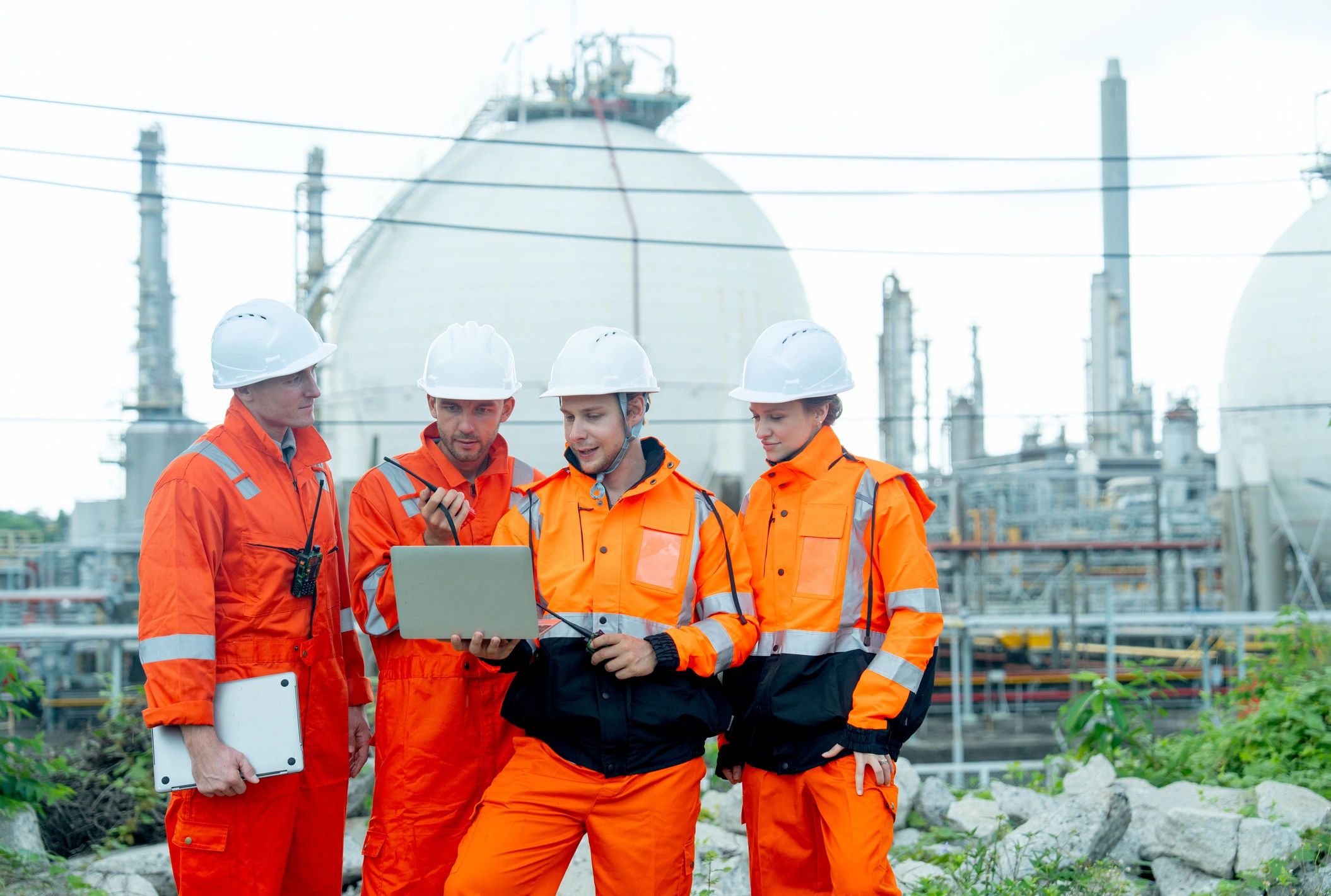 Engineering team discussing work at an industrial gas facility
